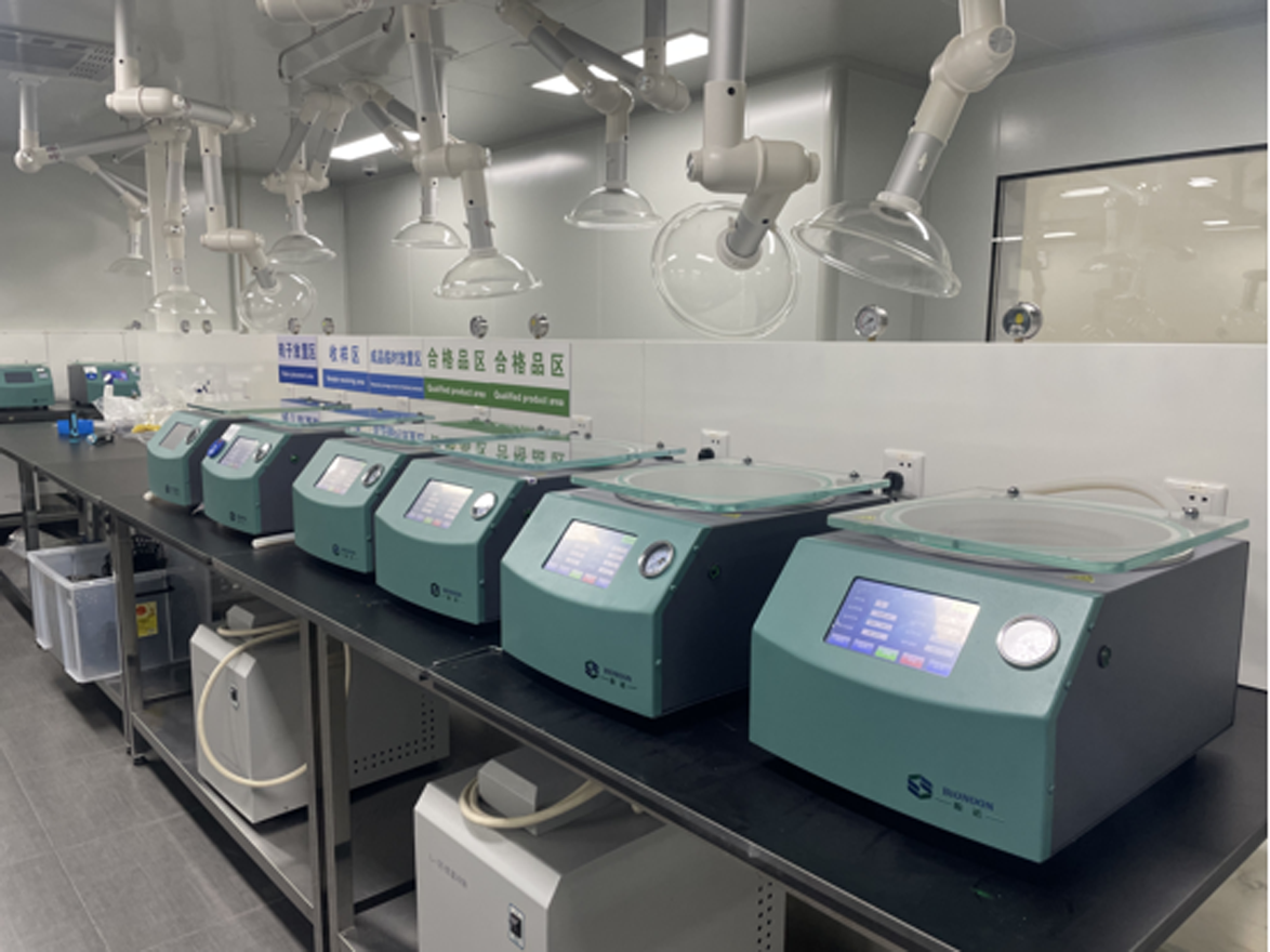 Stack of product boxes in a room with window background