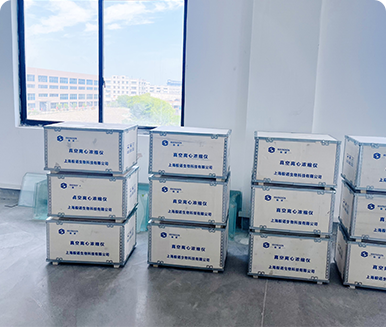 Stack of product boxes in a room with window background